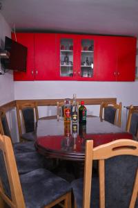 a dining room table with two bottles on it at Kuća Cvetković in Pirot