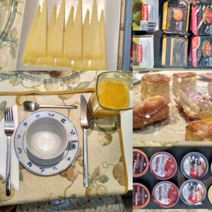a table with a plate of food and bread at Casa Rural Valdevilano in La Roca de la Sierra