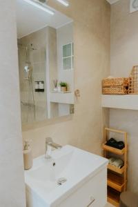 a bathroom with a white sink and a mirror at Chez Jean in Argos +37 photos
