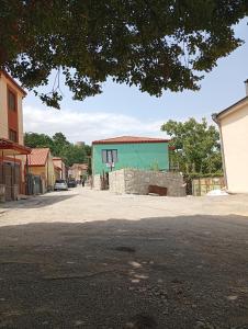 a street in a town with a green building at LZ Green House in Telavi