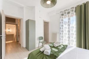 a bedroom with a bed and a chair in it at Domus dell'Angelo in Monte SantʼAngelo +50 photos