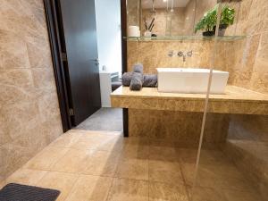 a bathroom with a sink and a mirror at Beacon Guest Rooms Sandyford in Sandyford