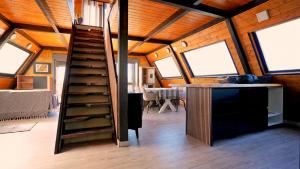 a room with a staircase in a tiny house at Cabin with jacuzzi and spectacular views in Oliva +33 photos