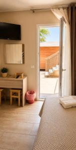 a bedroom with a bed and a sliding glass door at Martina paradise Etna in Nicolosi
