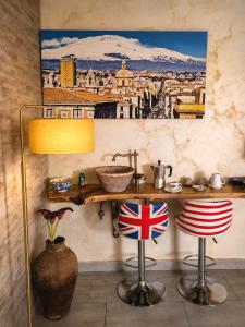 a painting of a city on the wall in a room at Martina paradise Etna in Nicolosi