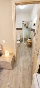 a bathroom with a shower and a toilet in it at Martina paradise Etna in Nicolosi +14 photos