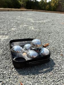 a black container filled with clams on the ground at Rural French Gite Sleeps 8 with Pool and Parking in La Croix-Comtesse