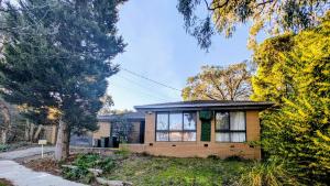 a brick house with a window on the side of it at Star House in Mitcham