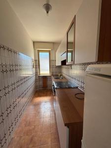 a kitchen with a sink and a counter top at Vecchio Mulino-Via Barale 40 in Entracque