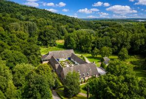 an aerial view of a house in the woods at Hotel Winselerhof by Flow in Landgraaf
