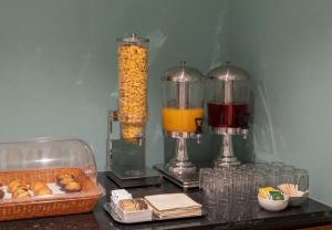 a table topped with two food items and two juice at asar Varanasi Junction by Orion Hotels in Varanasi +16 photos