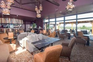 a lobby with a couch and chairs and tables at 3 Bed in Penrith oc-85896 in Penruddock