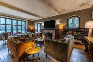 a living room with couches and a fireplace at 12 Bed in Bournemouth oc-t28236 in Bournemouth