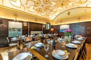 a dining room with a long table and chairs at 12 Bed in Bournemouth oc-t28236 in Bournemouth