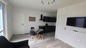 a living room with two chairs and a table at Bella Vita Stays Wellness in Sondrio
