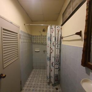 a bathroom with a shower with a shower curtain at Seaworld Guesthouse in Ao Nang Beach +22 photos
