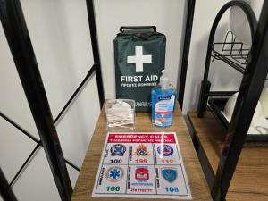 a table with a first aid kit and a bag at Garden Room with Private Patio Salamis in Eantio