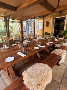 a large wooden table in a large room at The Queens Arms in Sherborne