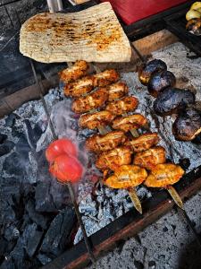 a bunch of food is cooking on a grill at Butik İsabel Otel in Kemer