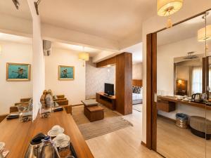 a living room with a couch and a table at Torbahan Boutique Hotel & Beach Club in Torba