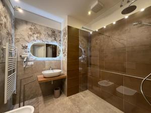 a bathroom with a sink and a shower at Majella vista Mare in Guardiagrele