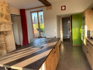 a kitchen with a large counter top in a room at Eden in Ceton +11 photos