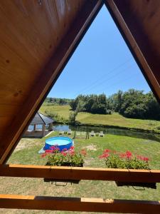 a view from a window of a backyard with a playground at Vila Kalkan in Šipovo