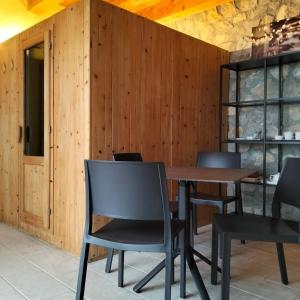 a dining room with a wooden table and chairs at Agritur Maso Carpenè in Rovereto +106 photos