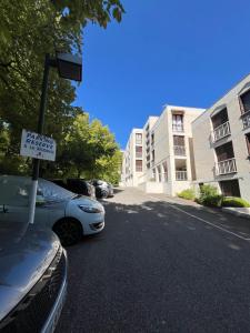a car parked in a parking lot with a sign at Mon Paradis en Provence B29 in Gréoux-les-Bains