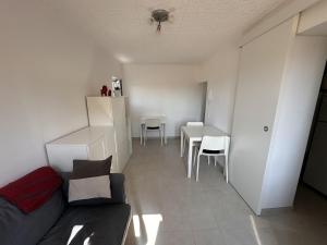 a living room with a couch and a table at Cozy Apartment in Chieti Centro in Chieti