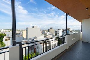 an apartment balcony with a view of a city at Minh Khang Apartment in Danang