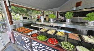 a buffet line with many different types of food at Aloria Garden Hotel in Erdek