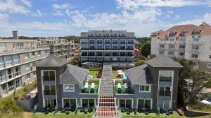 an aerial view of a house with buildings at Torrecillas Carilo in Carilo