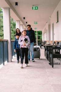 a group of people walking down a walkway at PÚŠŤ rekreačné stredisko in Prievidza