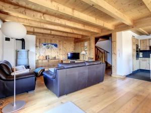 a living room with a couch and a table at Laiterie 1 in Verbier