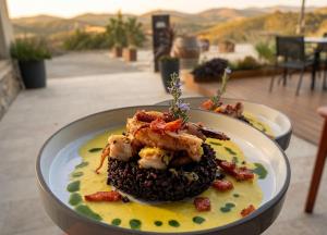 a plate of food sitting on a table at Château du Poët-Célard in Le Poët-Célard