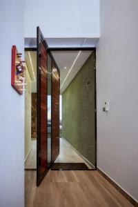 a hallway with a large mirror and a door at Pomona Palm Villa in Harare