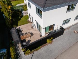 an overhead view of a house with a patio at 3S Holiday Home in Traunstein