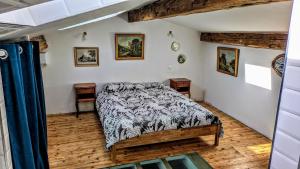 a bedroom with a bed and two night stands at 1860 Bordeaux - Lormont house in Lormont