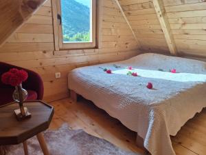 a bedroom with a bed with flowers on it at Oasis of Peace in Cetinje