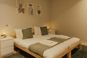 a bedroom with a large bed in a room at Gerês Thermae Retreat in Geres +57 photos