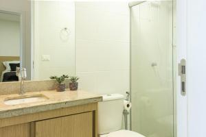 a bathroom with a shower with a toilet and a sink at Casa BACO - Morro de São Paulo in Cairu +17 photos