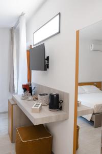 Televizors / izklaižu centrs naktsmītnē Maison Annelise