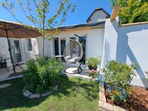 a home with a garden and a patio at Kúria Apartman Extra in Budapest