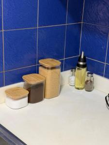 a kitchen counter with three trash cans on it at Departamento en Manta amoblado con seguridad privada in Manta +10 photos