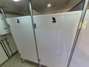 a couple of white stalls in a room at Willage camp i auto camp KOMARNICA in Šavnik