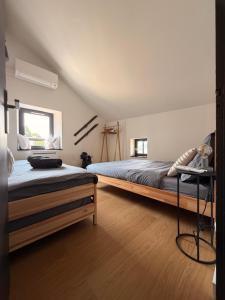 a bedroom with a large bed and a window at Refuge d'Odeillo Vue lac Luxe 8 pers Les Angles in Réal