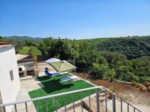 a view of a patio with a table and chairs at Villa Costa Viola in San Roberto