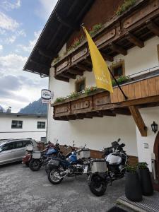a group of motorcycles parked outside of a building at Hotel Buckelhof - See - Free Liftpass Summer in See +81 photos