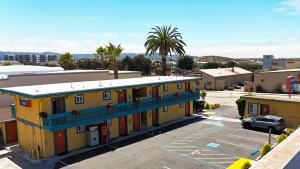 a view of a building in a parking lot at Seaside Inn Monterey in Seaside